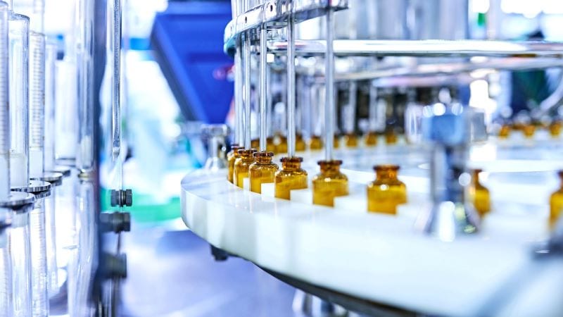 Glass pharmaceutical bottles on a production line