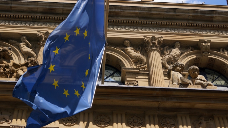 An EU flag flies outside the Frankfurt Stock Exchange