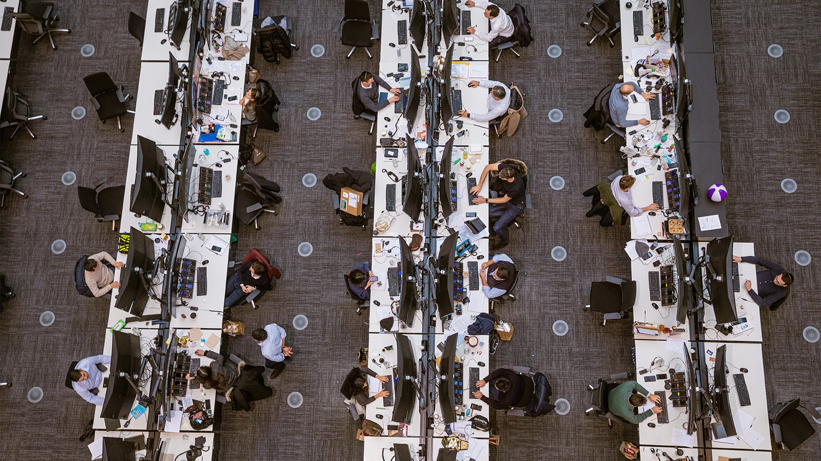Photo of a trading floor.