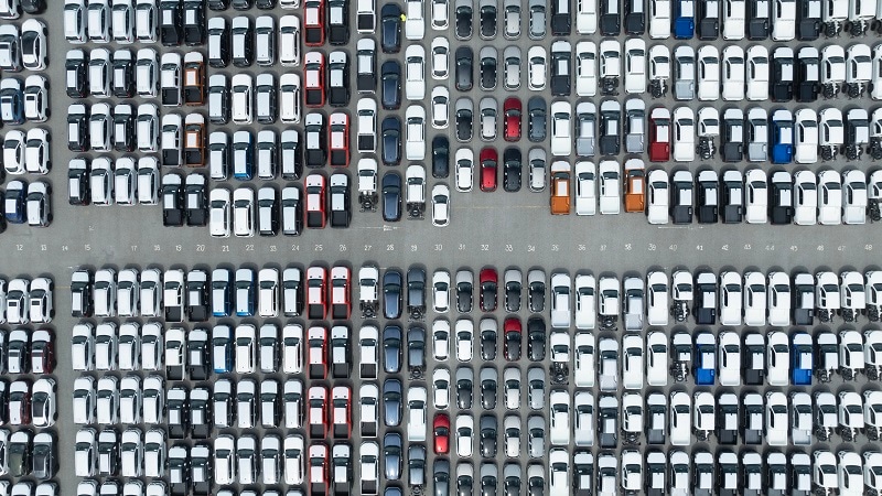 Aerial view of new cars lined up for export.