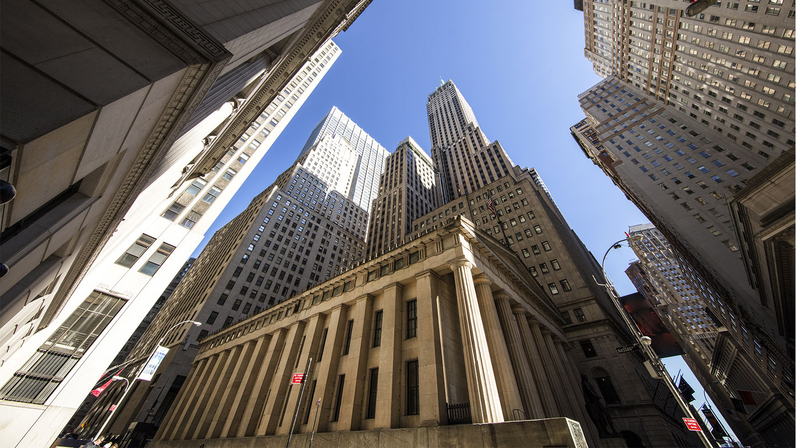 A photograph of the Lower Manhattan skyline and Wall Street.