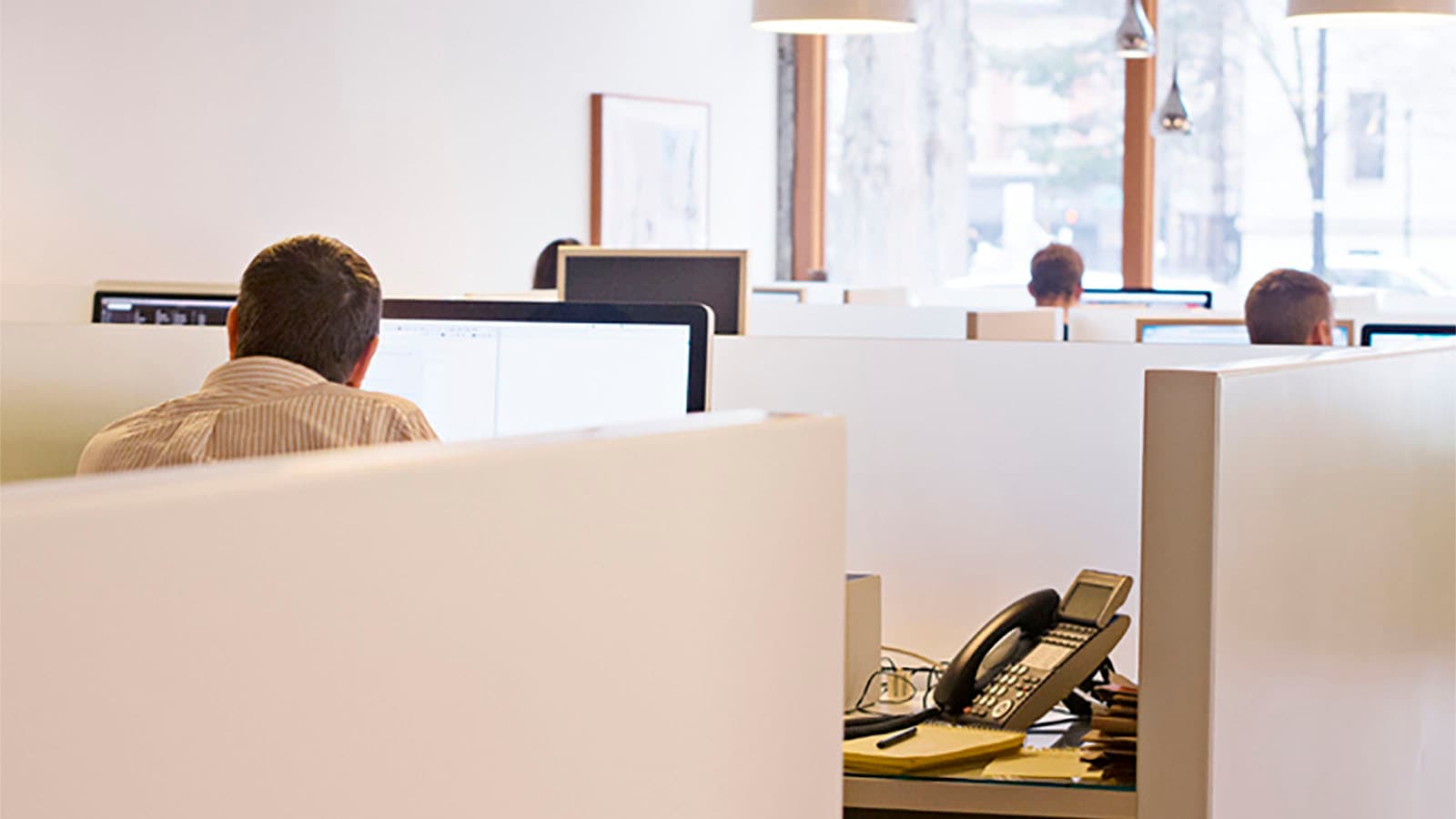 Photo of workers in an office.