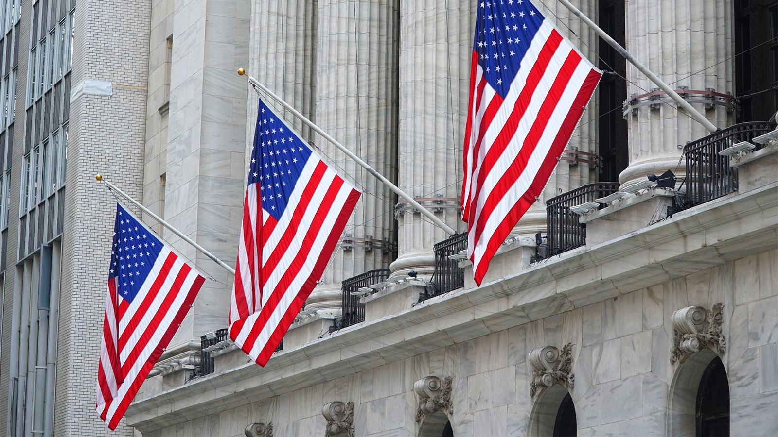 US flags hanging in front of the New York Stock Exchange