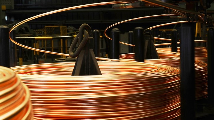 Photo showing reels of copper wire in a manufacturing setting